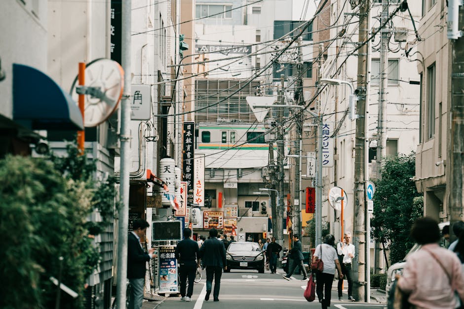 Vibrant street view in urban Japan with pedestrians and signage capturing cultural essence.