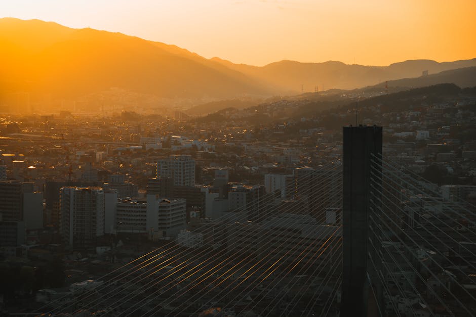 Stunning sunset over Ikeda city in Osaka, highlighting cityscape and mountain backdrop.