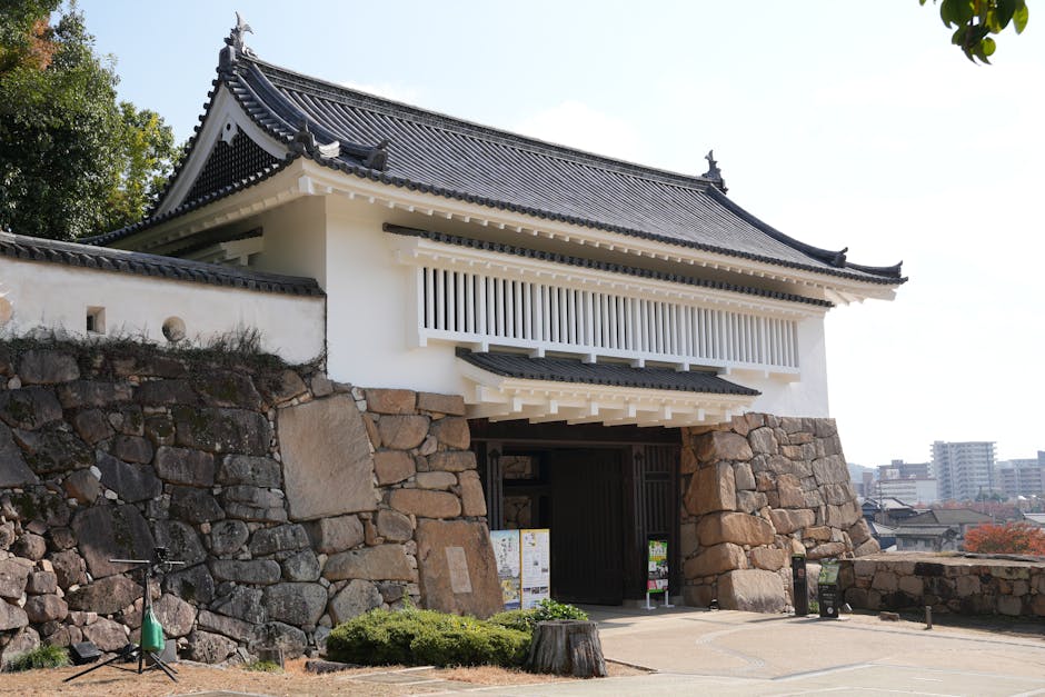 The traditional architectural gate of Okayama Castle showcasing Japanese craftsmanship.