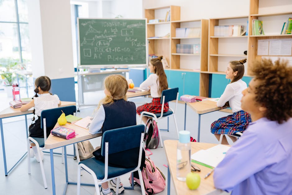 Students attentively participating in a school classroom environment.