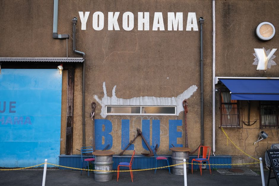 Colorful chairs and artistic wall design in a street scene from Yokohama, Japan.